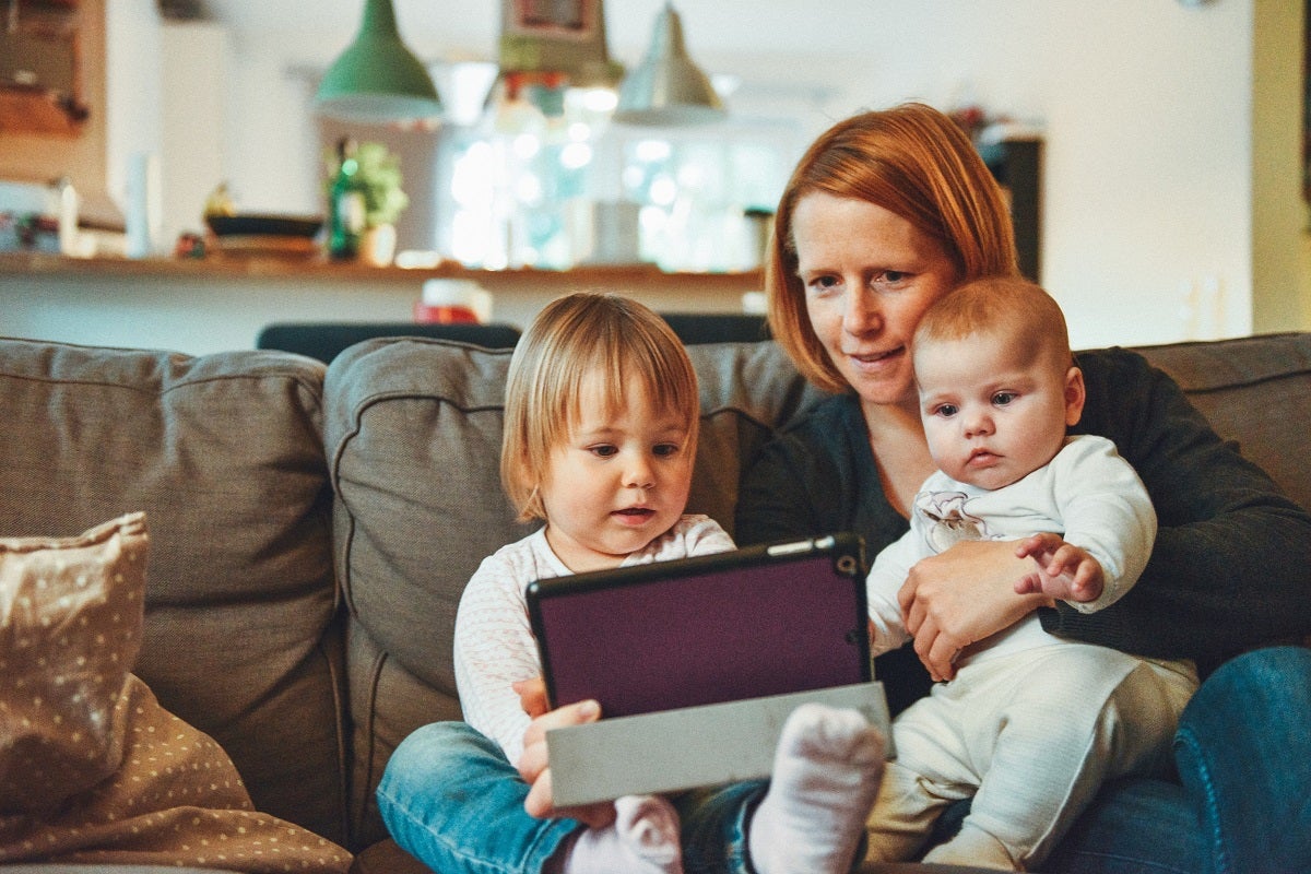 Mom and kids looking at a mobile device