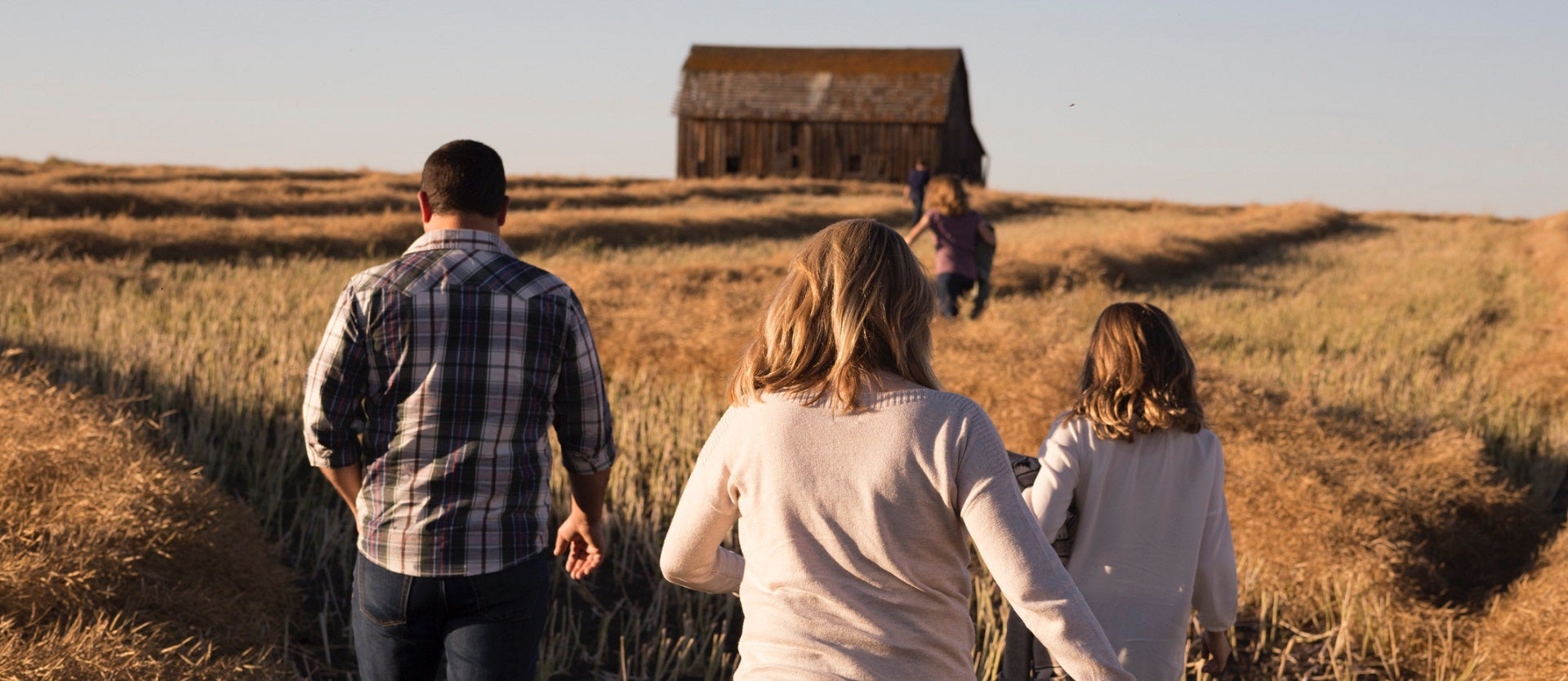 Picture of family walking in field